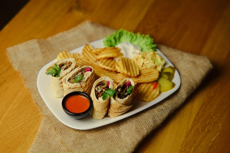 beef shwarma image Served with fries, a salad, and tahini sauce.