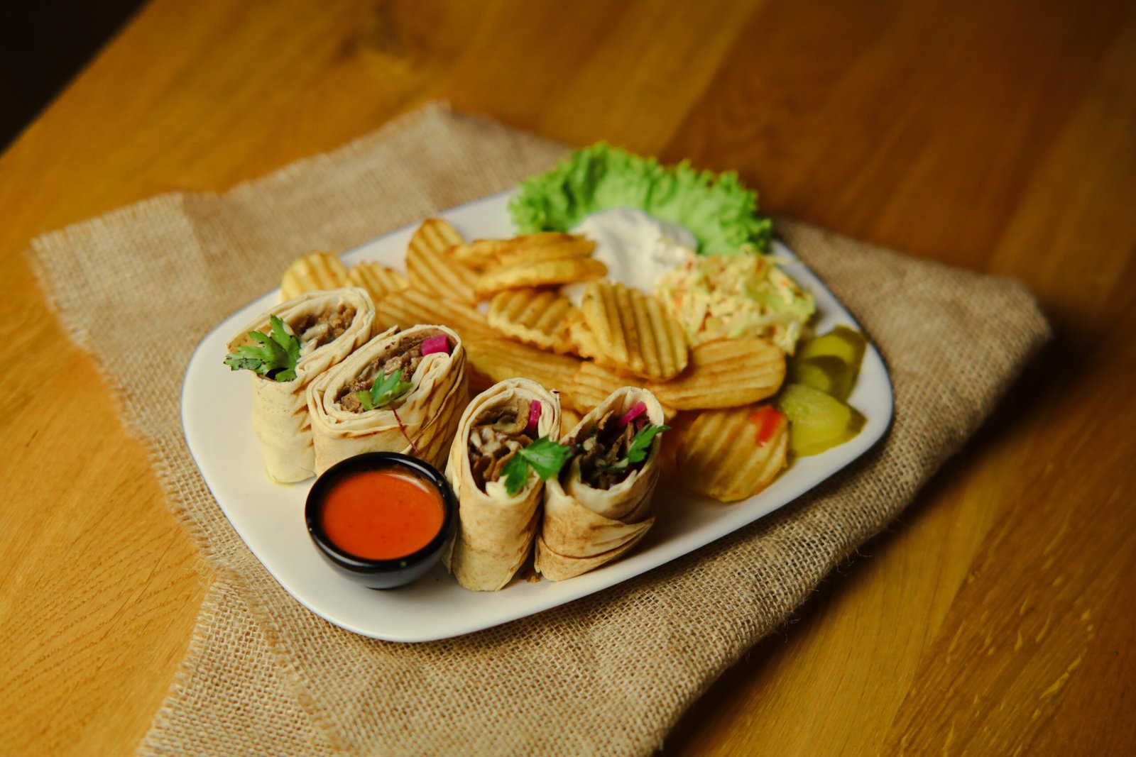 beef shwarma image Served with fries, a salad, and tahini sauce.